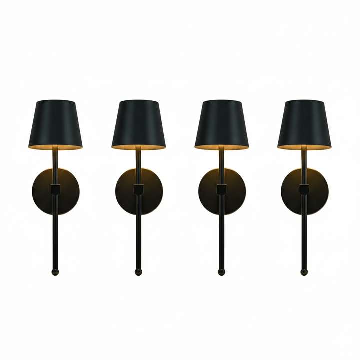 Four black wall lights with gold accents on a white background